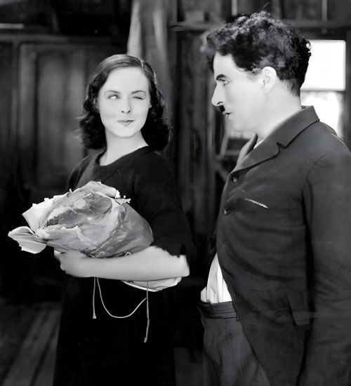 Paullete Godard and Charlie Chaplin as Little Tramp and Gamin in Modern Times 1936